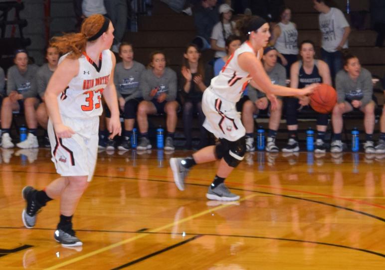 Tori Wyss, (left, #33) Ada High School grad and ONU junior, plays in the finals of the Ohio Athletic Conference women’s basketball tourney Saturday at King-Horn. She is a forward on the team. The Lady Bears lost to Marietta in the championship game. (Monty Siekerman photo)