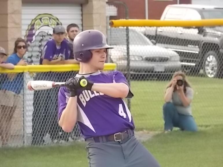 Ada senior shortstop Aaron Everhart leans back from an inside pitch in the sectionals vs. Fostoria. Everhart was voted first team All-NWC by league coaches.
