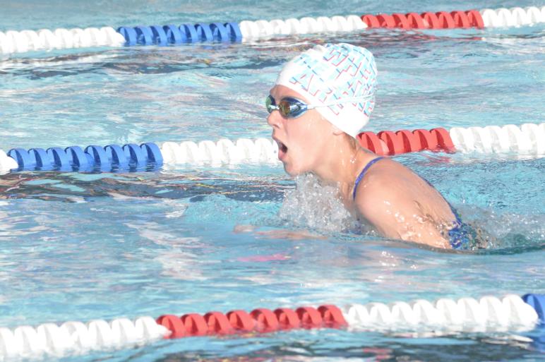 Breaststroking Lily Baumgartner finished first in five races for Ada vs. Westside Wednesday evening in the 11-12 age bracket.