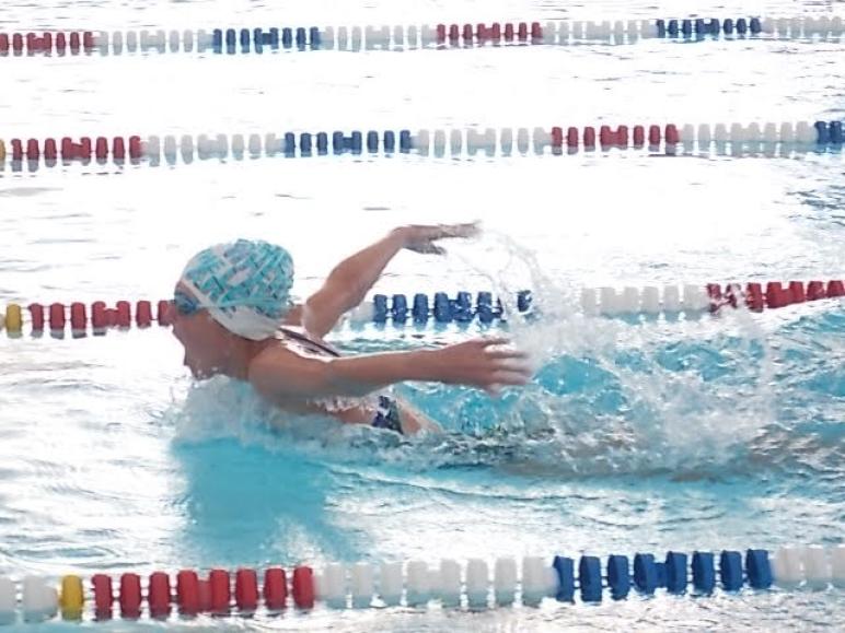 Ada's Carlie Oldfield won five races vs. Westside Wednesday night. Here she performs the difficult butterfly stroke.