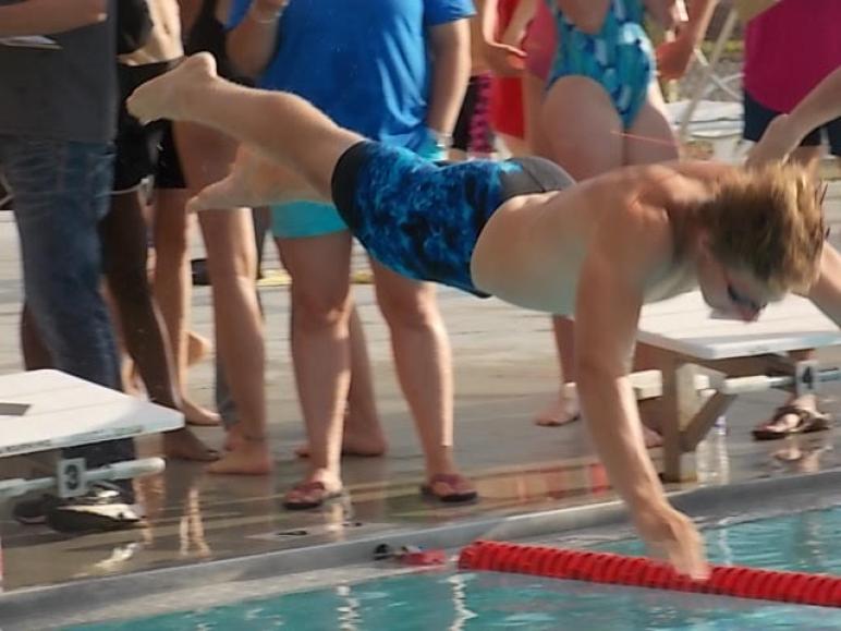 Ada's Tommy Spyker dives in for one of his two individual wins vs. Westside Wednesday.