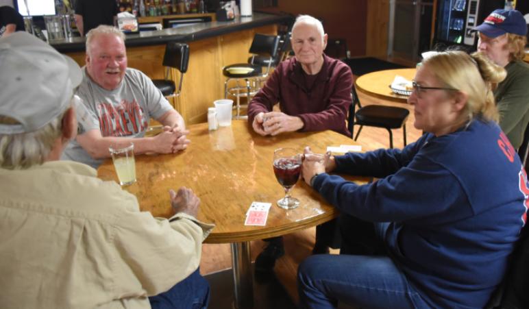 Mark Sunverhaus, Dick Lawrence, Jimmy Wilson (watching), Ellie Lauvus, and Gene Sexton found Euchre more fun the bowling