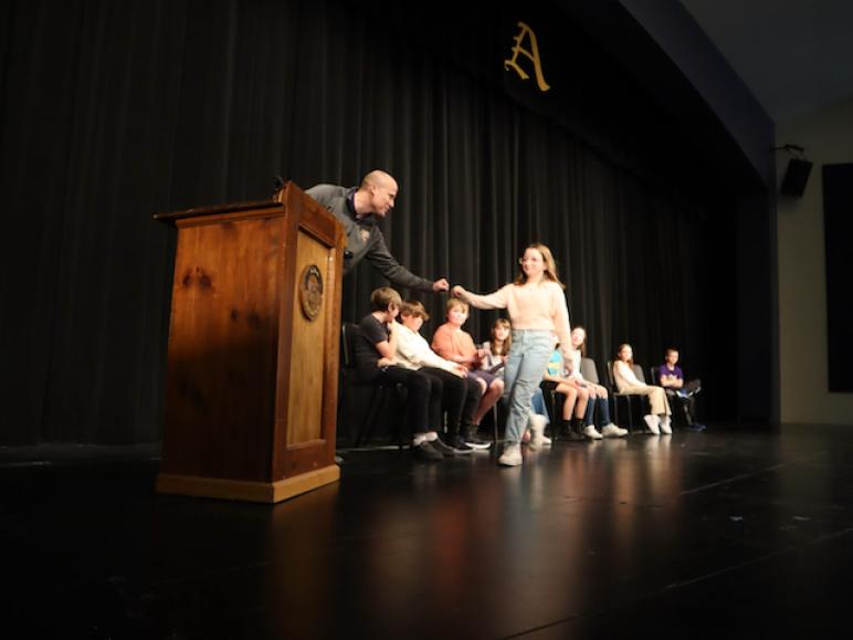Fist bumps with emcee Dan Lee