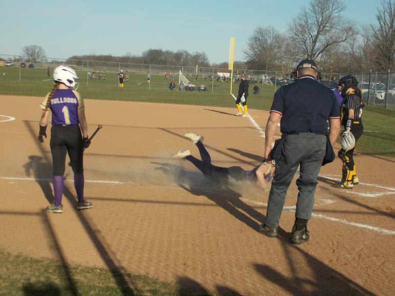 Ada junior Tessa Griffith scores on a headfirst slide / PHOTO by Cort Reynolds