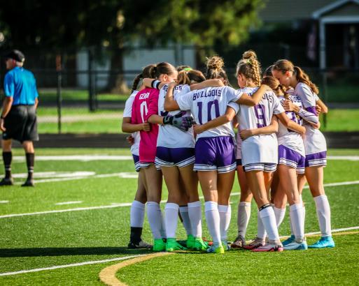 Ada girls soccer huddle