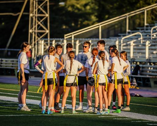 Powderpuff huddle at War Memorial Stadium